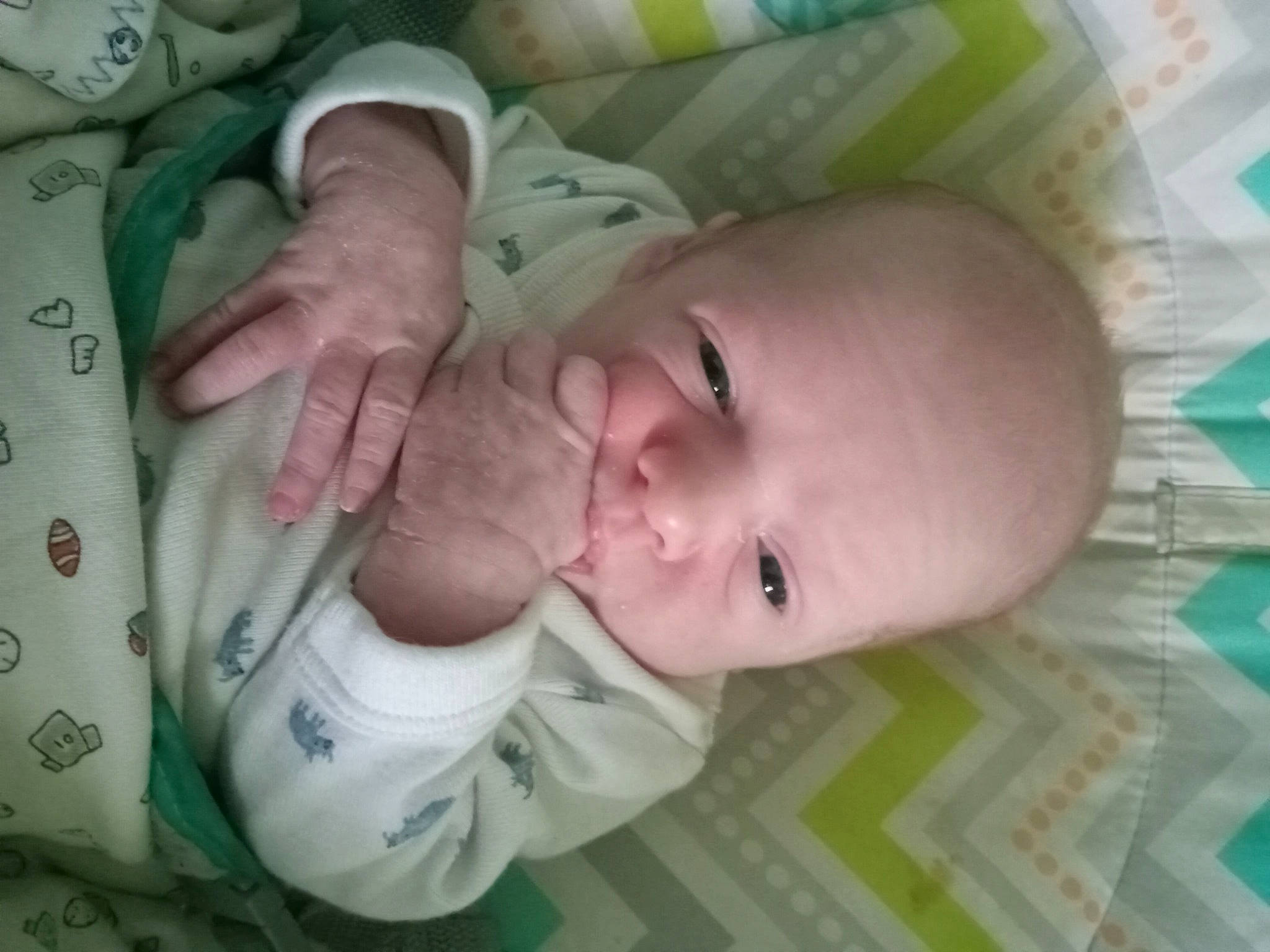 Tucker is registered to the contest to win money with this photo: baby, baby_products, baby_safety, baby_toddler_clothing, bedtime, cheek, child, comfort, finger, hand, infant_bed, iris, linens, mouth, nose, person, room, skin, sleep, thumb