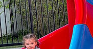 Willow joined the competition — help win amazing prizes! child, slide, playground, red, blue, outdoor, play, fun, smiling, braids, toddler, clothing, fence, greenery, sand, happy, casual, person, recreation, park