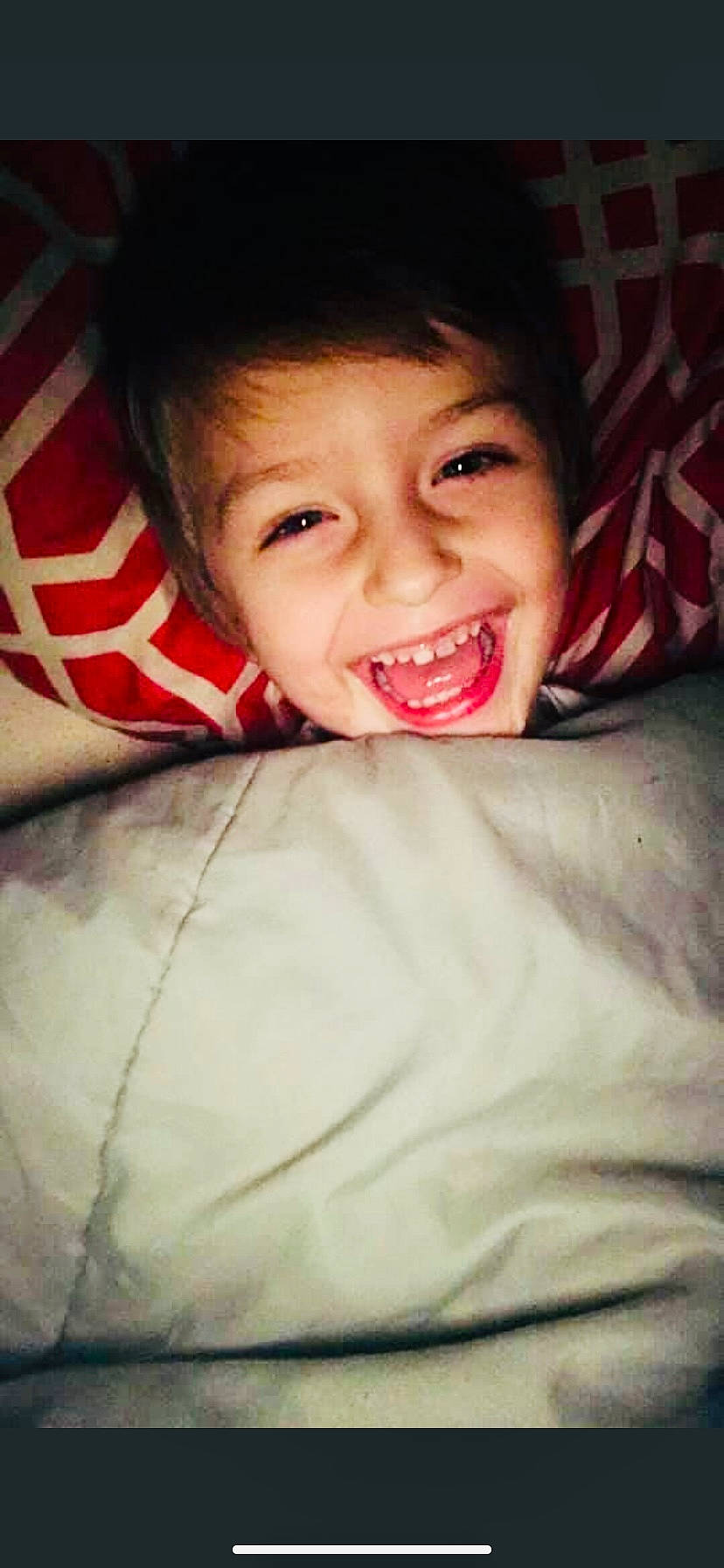 Colin is registered to the contest to win money with this photo: cheek, child, chin, comfort, eyebrow, flash_photography, fun, gesture, hair, happy, head, jaw, joy, lip, mouth, nose, person, sitting, smile, t_shirt