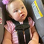 baby, child, car_seat, headband, pink, flower, straps, safety, seatbelt, infant, cute, chubby, gaze, clothing, toddler, indoor, person, skin, face, hand
