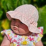 Ayra joined the competition — help win amazing prizes! baby, baby_fashion, child, closeup, cute, floral_dress, greenery, hand_holding, hat, infant, leaf, nature, outdoor, person, pink_hat, portrait, skin, soft_light, summer, sunlight