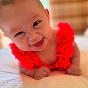 Emilia is registered to the contest to win money with this photo: accessories, baby, babylaughing, bodypart, face, finger, flower, flowerarrangement, hand, happy, head, jewelry, laughing, necklace, newborn, person, photography, plant, portrait, smile