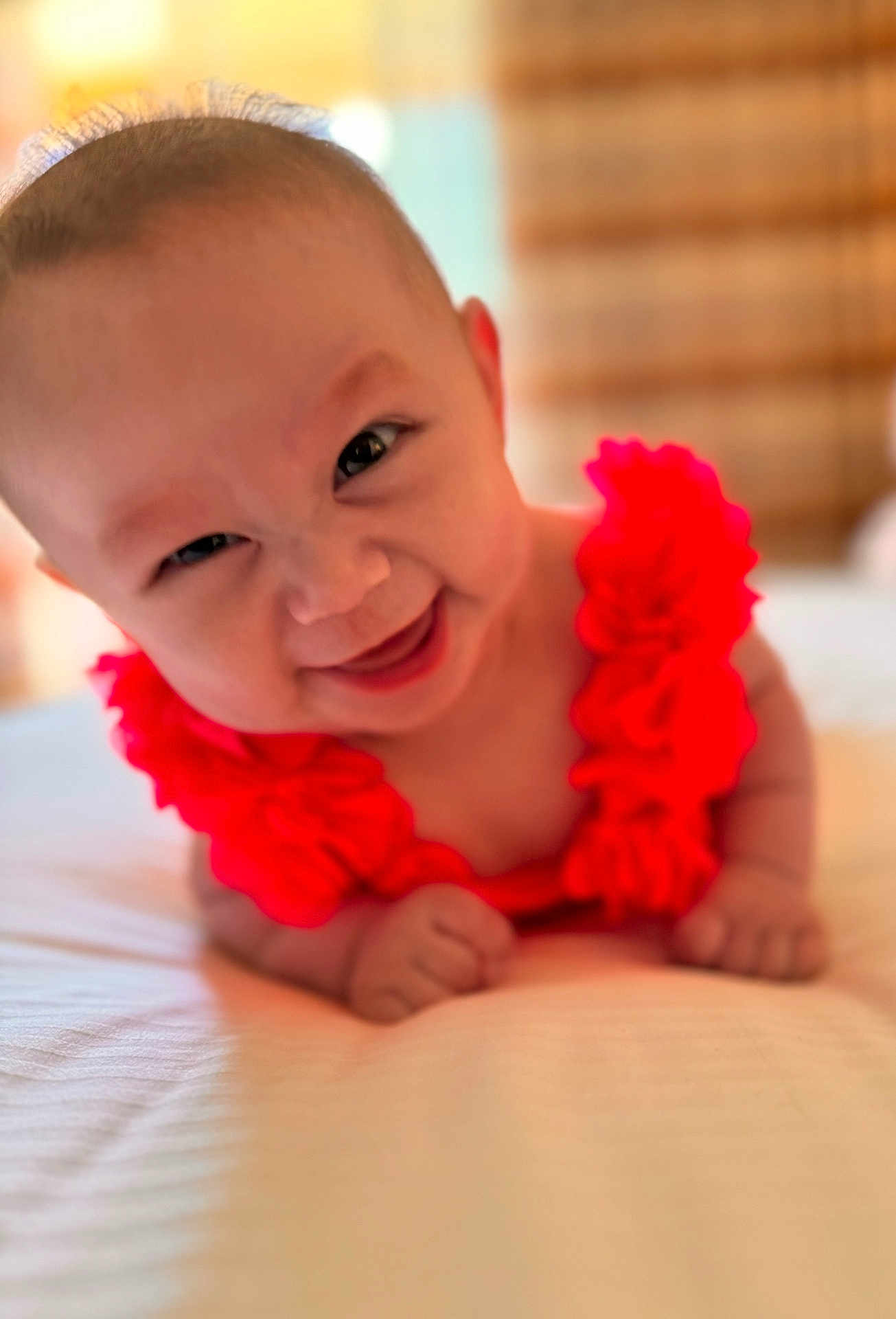 Emilia is registered to the contest to win money with this photo: accessories, baby, babylaughing, bodypart, face, finger, flower, flowerarrangement, hand, happy, head, jewelry, laughing, necklace, newborn, person, photography, plant, portrait, smile