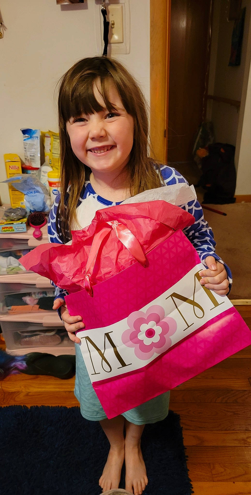Paisley is registered to the contest to win money with this photo: bag, bangs, child, costume, event, fashion_accessory, fun, hair, joy, linens, long_hair, magenta, pattern, peach, person, pink, skin, sleeve, smile, t_shirt
