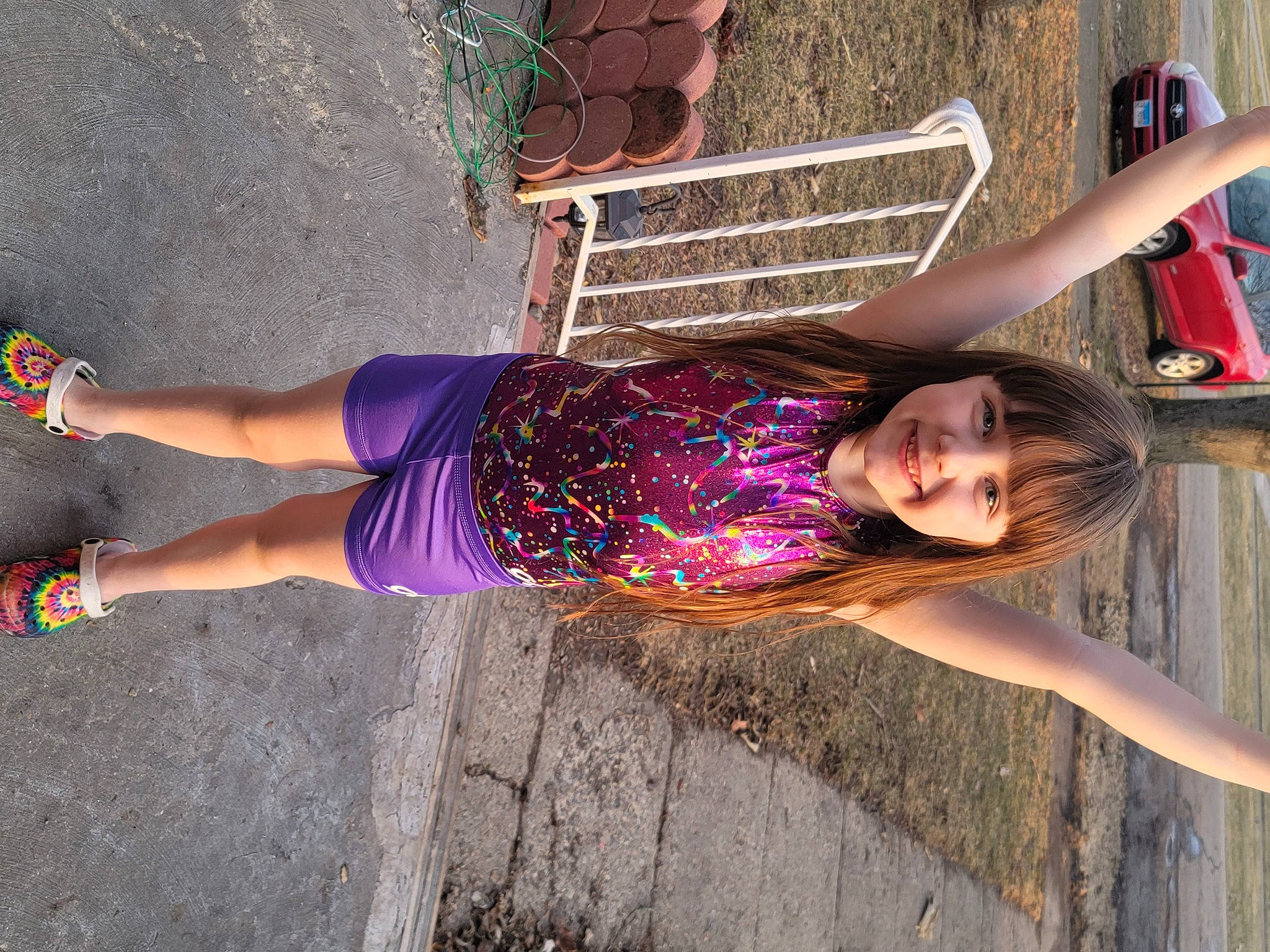 Paisley is registered to the contest to win money with this photo: arm, child, clothing, electric_blue, face, facial_expression, fun, happy, human_leg, joy, leisure, magenta, person, pink, purple, smile, textile, thigh, tints_and_shades, trunk