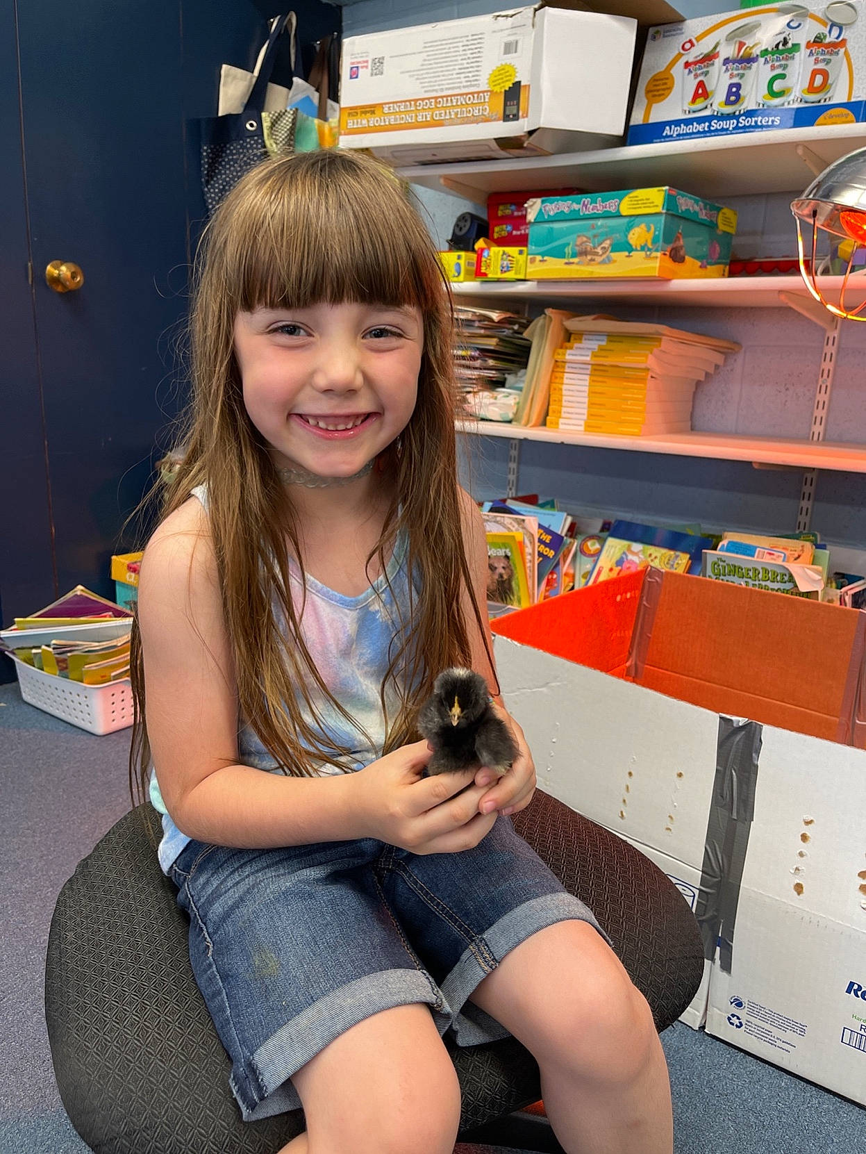 Paisley joined the competition — help win amazing prizes! beauty, facial_expression, finger, fun, hair, happy, joy, knee, lap, leg, leisure, long_hair, organ, person, shelf, shelving, shorts, skin, smile, standing