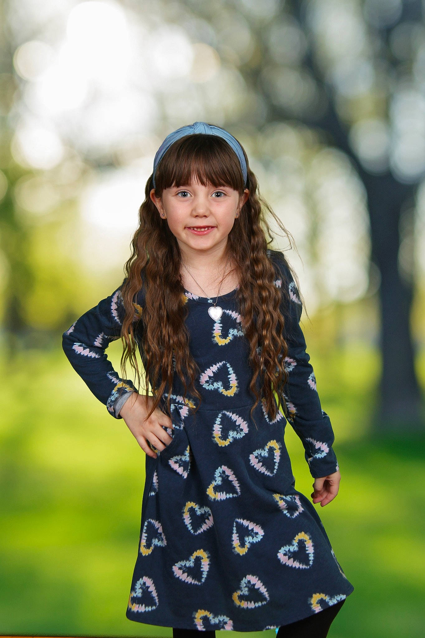 Paisley is registered to the contest to win money with this photo: bangs, black_hair, brown_hair, cool, electric_blue, face, fashion, flash_photography, grass, hair, happy, joy, long_hair, outerwear, pattern, people_in_nature, person, plant, sleeve, sunlight