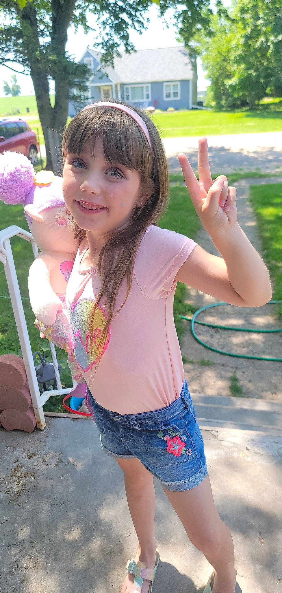 Paisley joined the competition — help win amazing prizes! cool, face, facial_expression, finger, fun, gesture, grass, green, hair, happy, human_body, joy, leisure, person, pink, plant, shorts, skin, sleeve, smile