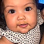 baby, infant, face, closeup, cute, child, polka_dot, clothing, skin, eyes, smile, indoor, portrait, chubby_cheeks, young, person, cute_outfit, adorable, human, baby_girl