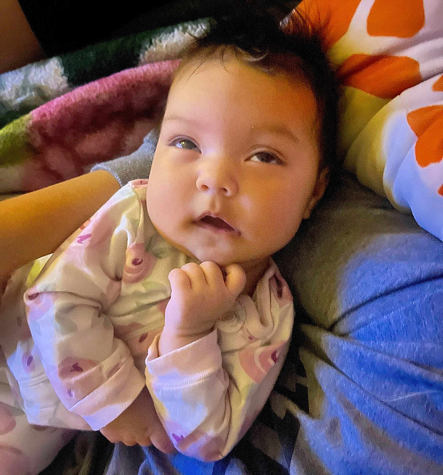 Sariyah is registered to the contest to win money with this photo: baby, infant, pajamas, sleepwear, blanket, pillow, resting, child, face, hand, comfort, indoor, portrait, cute, cozy, soft, expression, person, newborn, warm