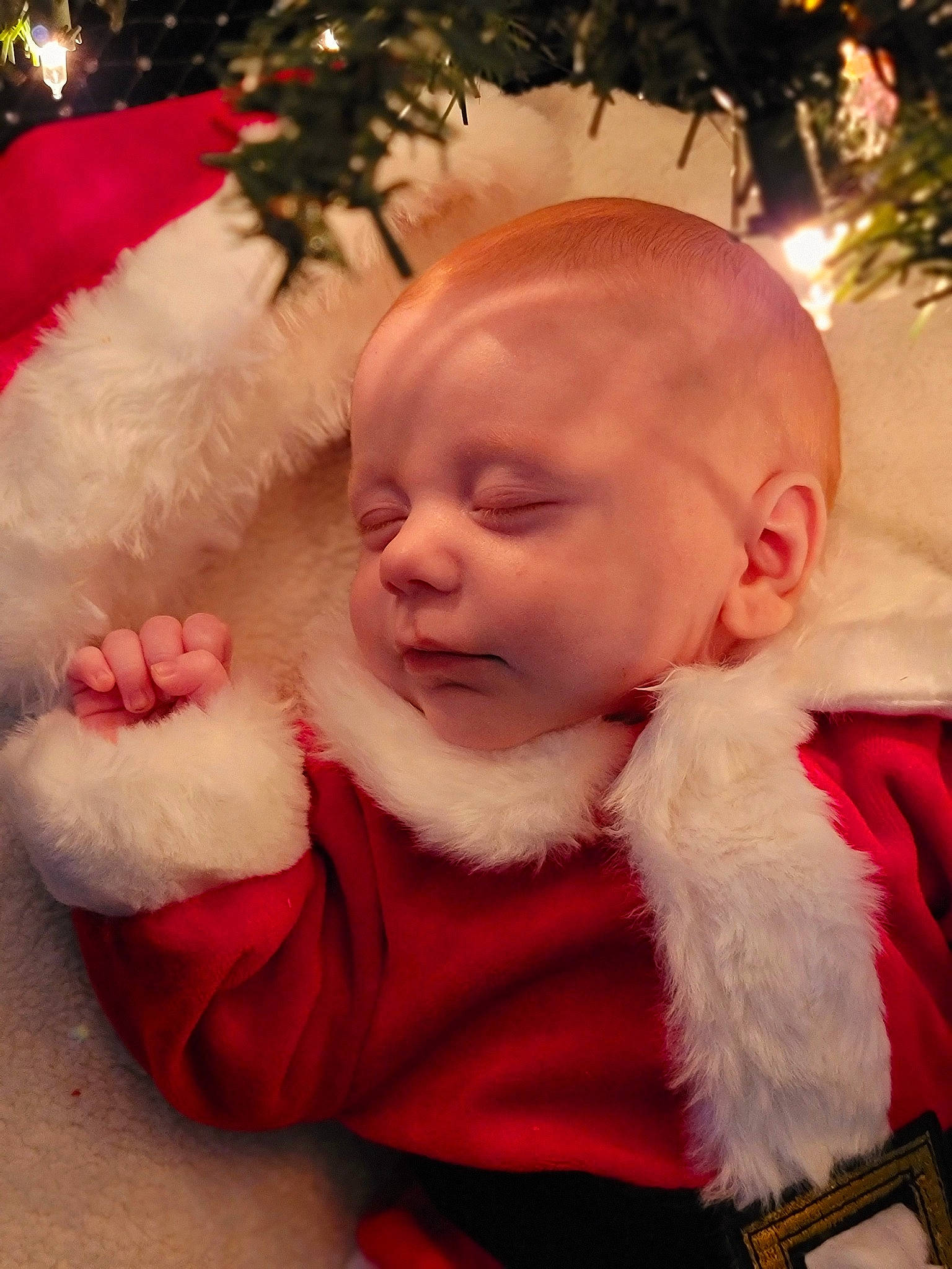 Dmitri is registered to the contest to win money with this photo: baby, baby_toddler_clothing, cheek, child, christmas_ornament, event, eye, fun, gesture, happy, head, human_body, lap, lip, mouth, nose, person, santa_claus, skin, toddler
