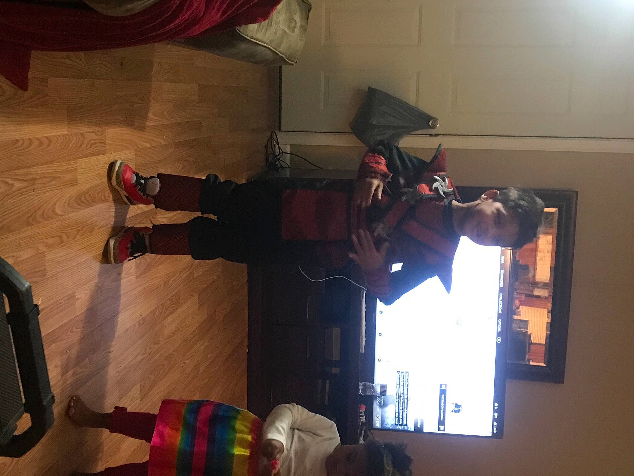 Jahlil joined the competition — help win amazing prizes! boot, carmine, curtain, display_device, elbow, event, flooring, fun, hardwood, human_leg, joy, knee, luggage_and_bags, person, personal_protective_equipment, recreation, room, shadow, sneakers, standing