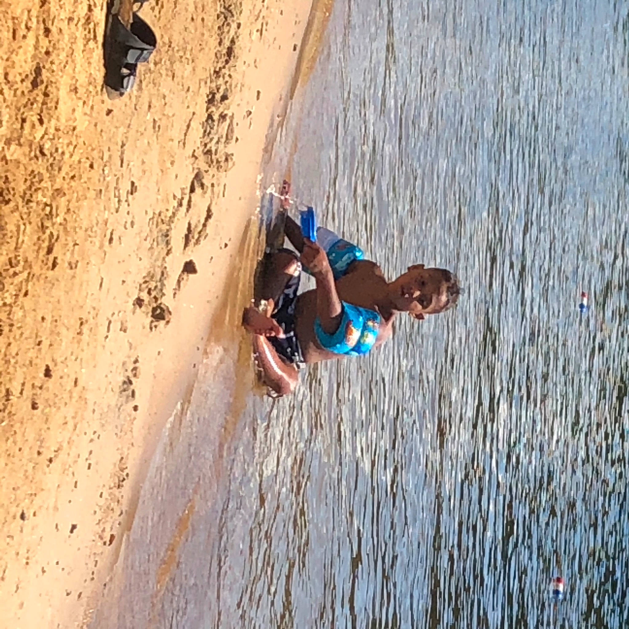 Jailyn is registered to the contest to win money with this photo: adventure, beach, cliff, electric_blue, extreme_sport, fun, happy, lake, landscape, leisure, ocean, people_in_nature, people_on_beach, person, recreation, smile, sunglasses, travel, water, wind_wave