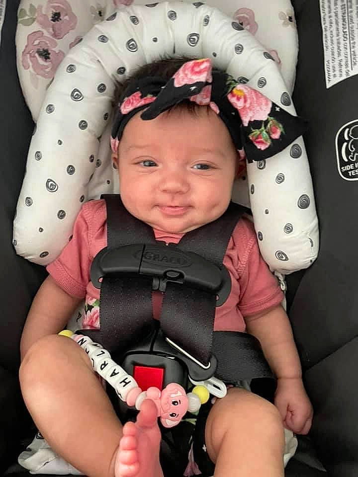 Harlan joined the competition — help win amazing prizes! baby_toddler_clothing, black, cheek, chin, comfort, eye, finger, head, headwear, lip, neck, organ, outerwear, person, photograph, pink, product, skin, sleeve, smile