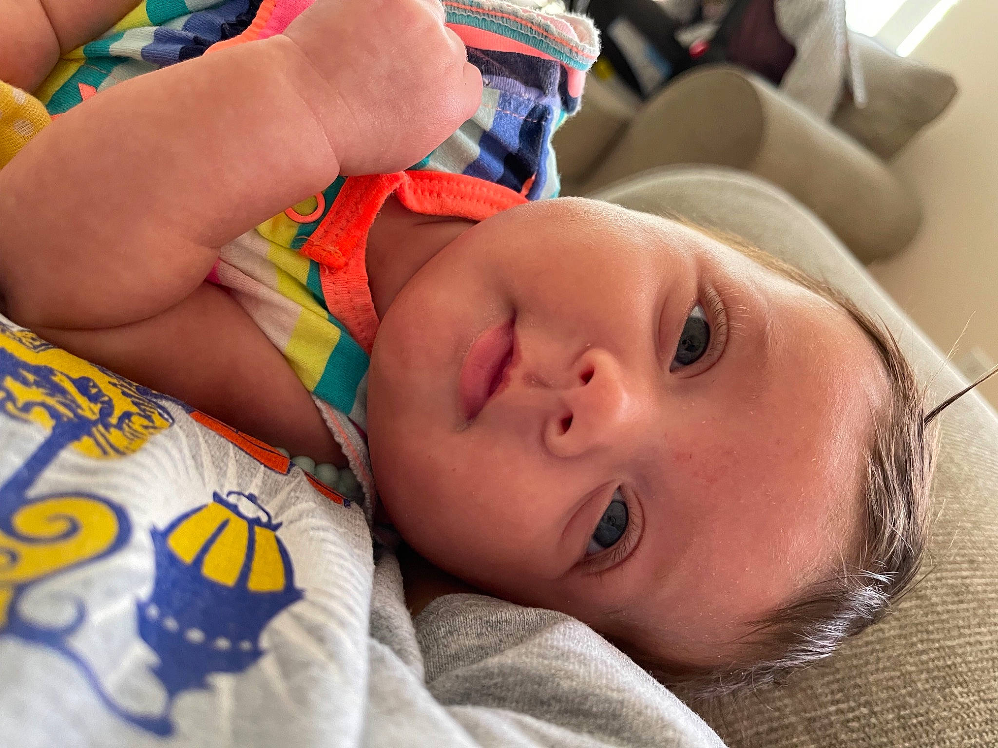 Harlan is registered to the contest to win money with this photo: baby, baby_products, beauty, cheek, chest, child, close_up, comfort, eyelash, finger, fun, happy, mouth, nose, orange, organ, person, product, skin, textile