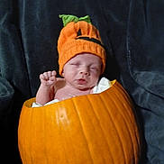 Owen joined the competition — help win amazing prizes! baby, pumpkin, knitted_hat, sleepy, cute, halloween, orange, face, infant, costume, child, fist, hat, cozy, portrait, person, holiday, seasonal, soft, warm