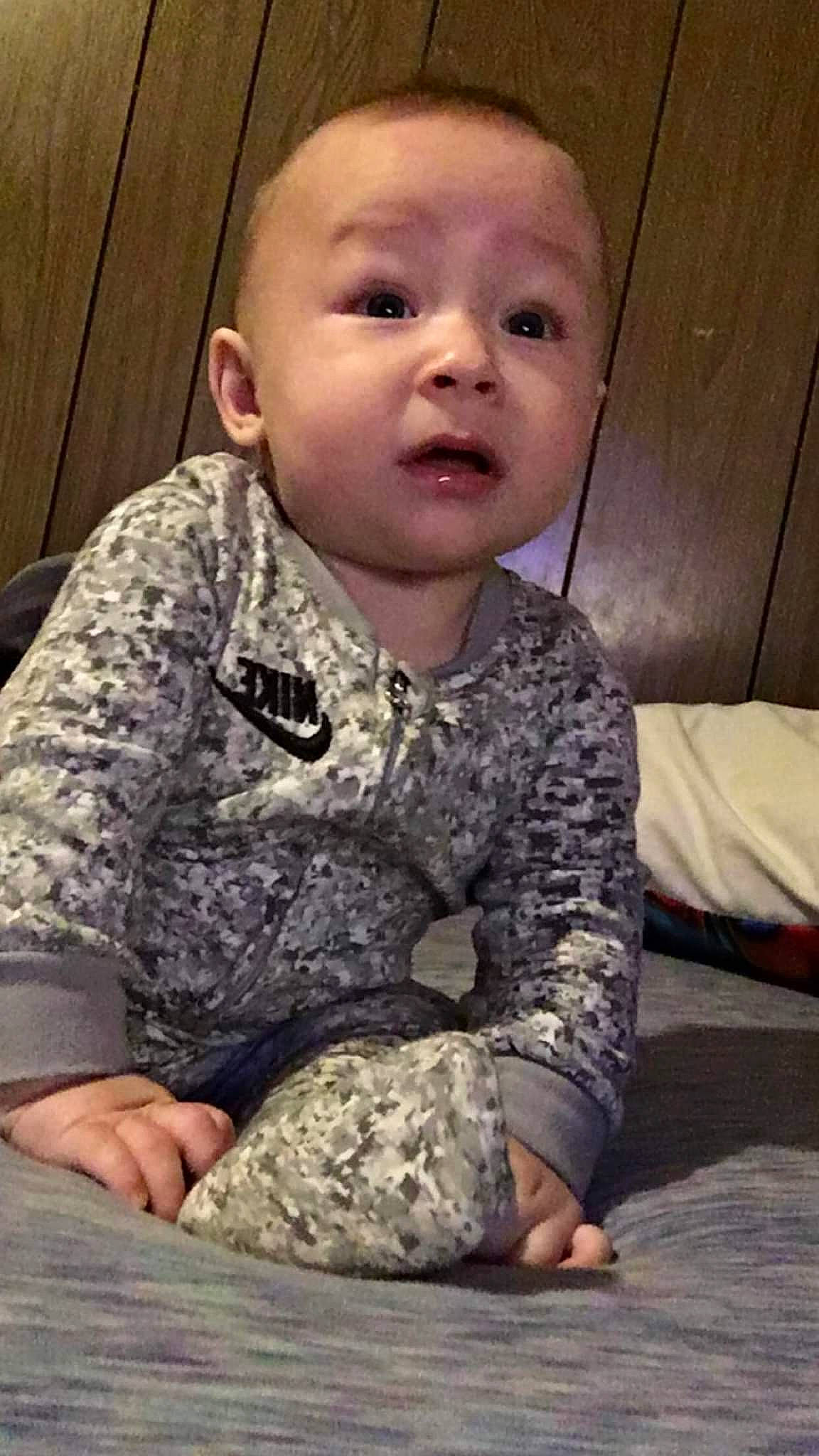 Markus joined the competition — help win amazing prizes! arm, baby, baby_toddler_clothing, camouflage, cheek, comfort, face, facial_expression, gesture, hand, human_body, mammal, military_camouflage, nose, outerwear, pattern, person, skin, sleeve, surprise