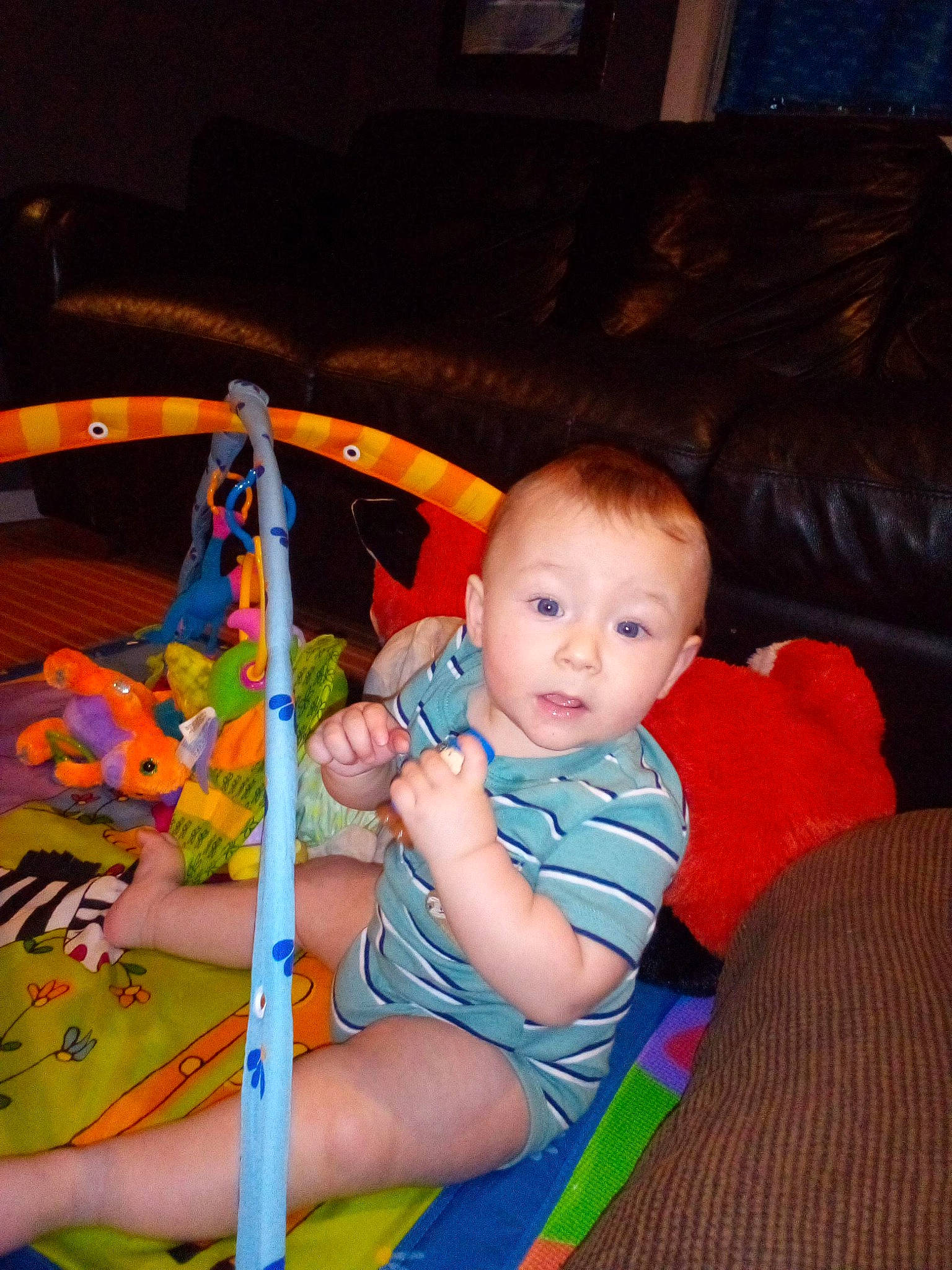 Markus joined the competition — help win amazing prizes! baby, baby_products, baby_toddler_clothing, baby_toys, cheek, child, comfort, couch, flooring, fun, iris, lap, living_room, mouth, person, play, room, sitting, surprise, thigh