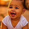 baby, child, smiling, drool, white_shirt, close_up, cute, happy, portrait, infant, skin, face, eyes, mouth, head, outdoor, warm_light, expression, person, young