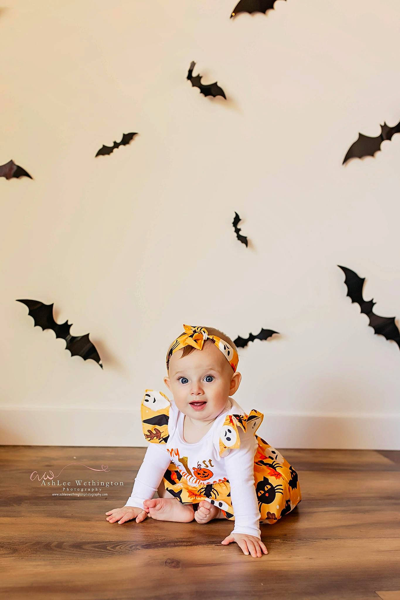 Hadley is registered to the contest to win money with this photo: art, baby, baby_toddler_clothing, doll, flooring, font, graphic_design, happy, landscape, pattern, people_in_nature, person, plant, surprise, toddler, toy, visual_arts, wall_sticker