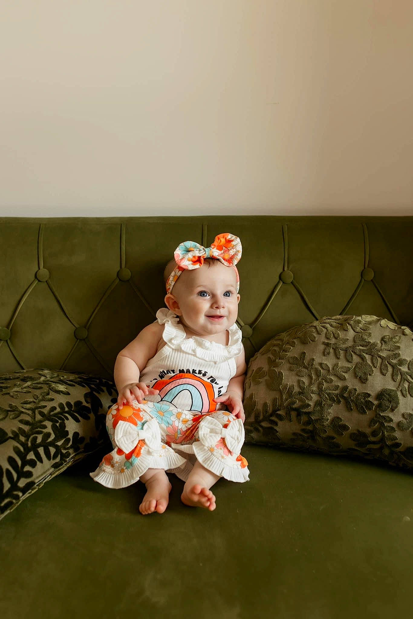Hadley is registered to the contest to win money with this photo: baby, baby_toddler_clothing, child, comfort, couch, eye, flash_photography, flooring, foot, goggles, grass, human_body, human_leg, joy, knee, person, room, sitting, sleeve, thigh