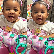 Elyvia is registered to the contest to win money with this photo: baby, child, smiling, pink_clothing, purple_bow, toy, colorful, indoor, face, happy, person, activity_center, infant, cute, playtime, portrait, babygirl, accessory, jewelry, split_image
