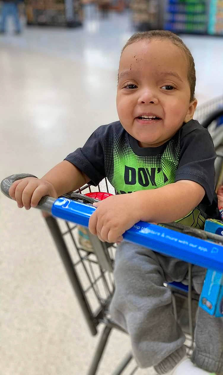 D'Quarius is registered to the contest to win money with this photo: baby, baby_products, baby_toddler_clothing, child, electric_blue, finger, fun, happy, leisure, person, play, product, recreation, room, sitting, skin, smile, standing, t_shirt, thumb