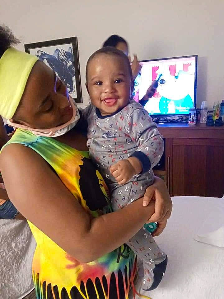 Z'Aidyn joined the competition — help win amazing prizes! baby, baseball_cap, cap, child, display_device, event, fun, happy, hat, joy, leisure, person, personal_protective_equipment, room, sitting, smile, sun_hat, t_shirt, table, television