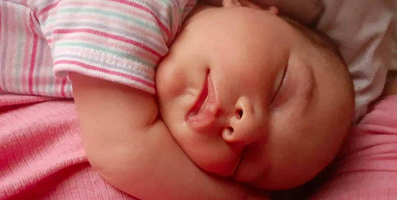 Francesca is registered to the contest to win money with this photo: baby_sleeping, baby_toddler_clothing, bedtime, cheek, child, chin, comfort, eyebrow, eyelash, face, facial_expression, forehead, human, lip, mouth, nap, nose, organ, person, skin