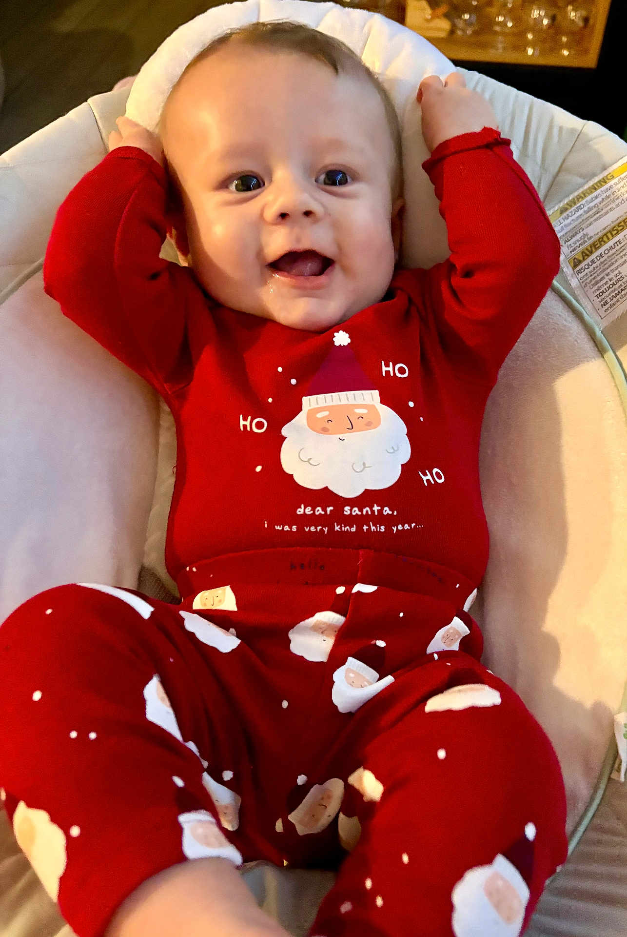 Aaron participe au concours pour gagner de l'argent avec cette photo : baby, child, red_pajamas, santa_claus, holiday_clothing, infant, smiling, happy, face, cute, indoors, cushion, seat, relaxed, christmas, festive, person, portrait, comfort, joyful