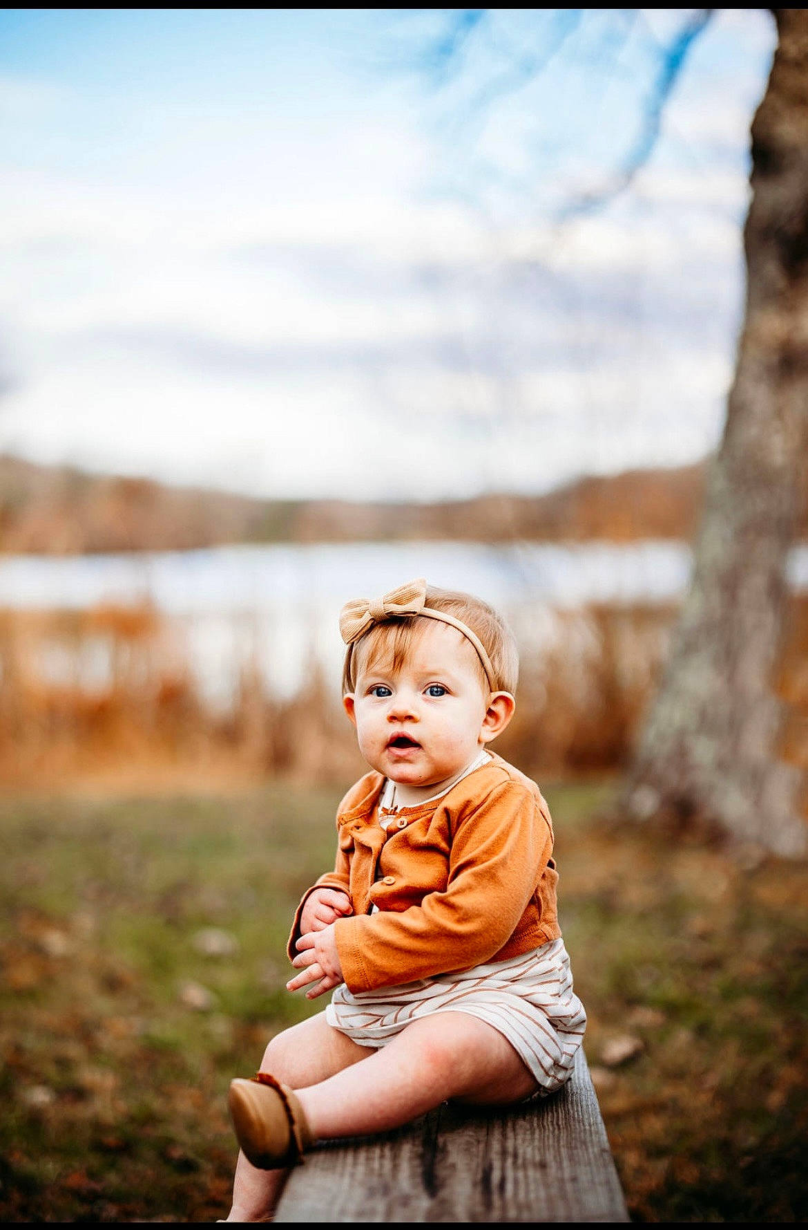 Lylah joined the competition — help win amazing prizes! baby, baby_toddler_clothing, child, cloud, flash_photography, grass, grassland, happy, landscape, people_in_nature, person, plant, portrait_photography, rock, sitting, sky, stock_photography, sunlight, toddler, tree