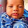 baby, infant, face, portrait, closeup, blue_stripes, blanket, newborn, child, cute, swaddled, expression, skin, head, person, young, indoors, soft_light, warm, small