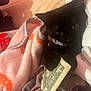 Yuumi joined the competition — help win amazing prizes! black_cat, kitten, blanket, money, dollar_bill, paw, indoor, cozy, soft, cute, pet, animal, feline, collar, playing, resting, pink_wall, textile, fabric, domestic