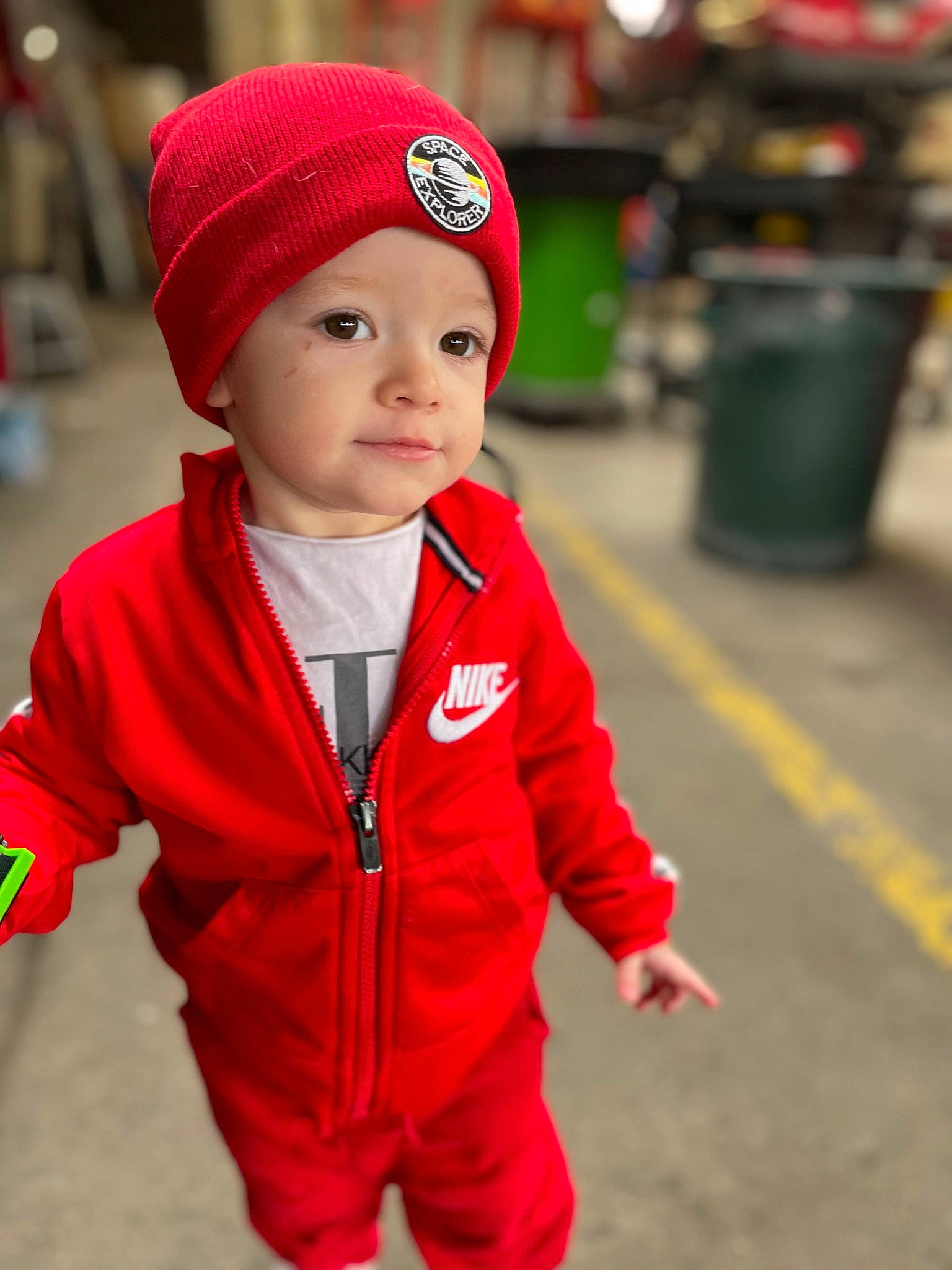Sebastian is registered to the contest to win money with this photo: baby, baby_toddler_clothing, cap, child, event, face, happy, headgear, headwear, holiday, jacket, knit_cap, person, personal_protective_equipment, plant, recreation, sleeve, standing, street_fashion, toddler