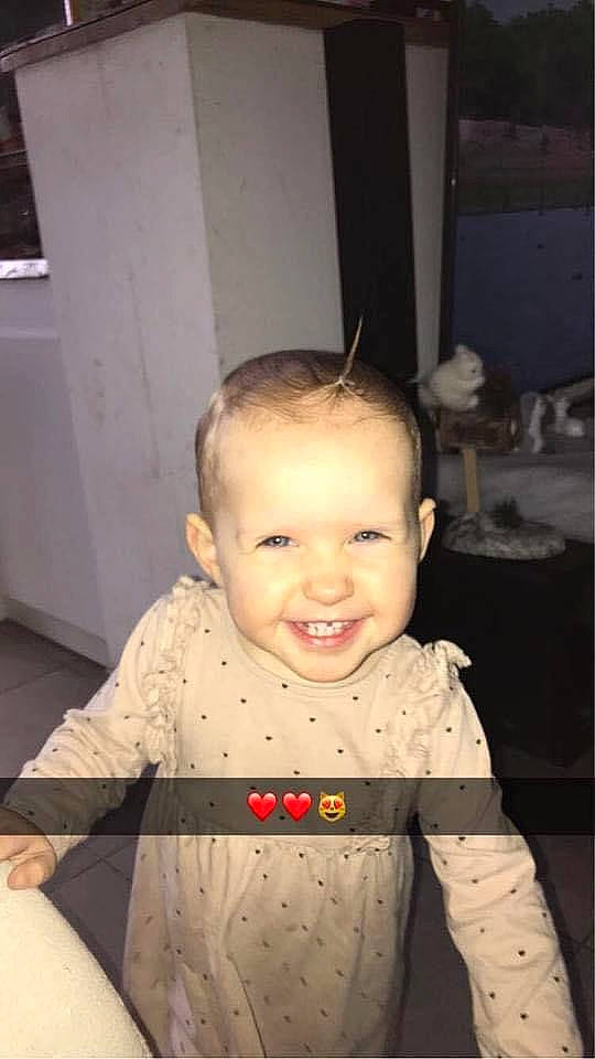 Naëlyne a rejoint le concours — aidez-le/la à gagner de superbes lots ! baby, baby_products, baby_toddler_clothing, chair, cheek, child, eye, flooring, fun, happy, iris, joy, nose, pattern, person, room, sitting, sleeve, smile, t_shirt