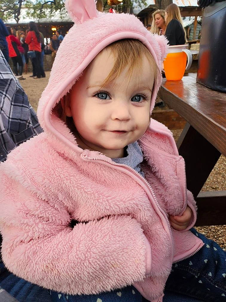 Fallon joined the competition — help win amazing prizes! baby, cheek, child, ear, eye, face, fur, fur_clothing, head, headgear, headwear, organ, outerwear, person, pink, skin, smile, toddler