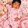 baby, infant, child, portrait, sleeping, pink, pajamas, onesie, teddy_bear, blanket, bed, floral_pattern, strawberry_pattern, crown, princess, heart, cute, indoors, lying_down, text