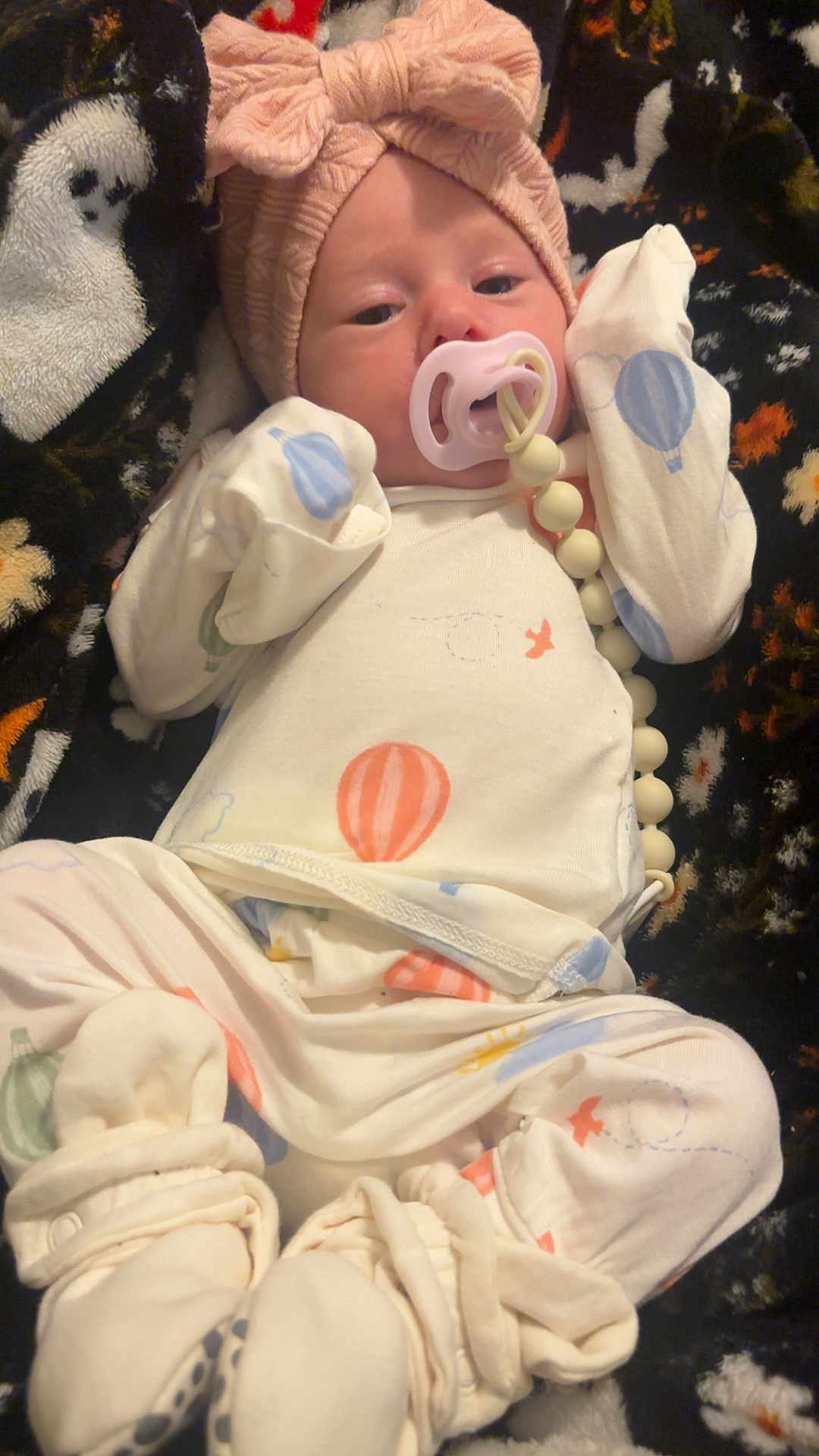 Opaline joined the competition — help win amazing prizes! baby, infant, pacifier, pacifier_clip, headband, bow, onesie, hot_air_balloon, blanket, pattern, booties, mittens, beads, portrait, close_up, cozy, soft_fabric, newborn_style, indoors, sleepwear