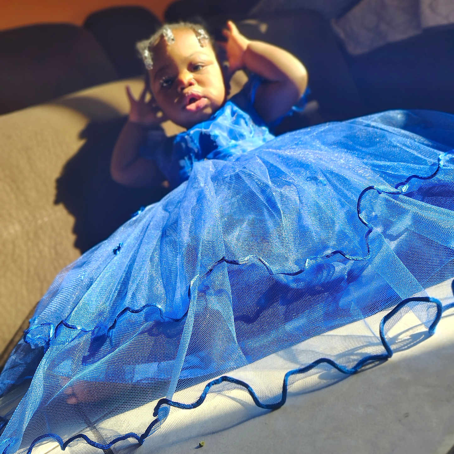Enori is registered to the contest to win money with this photo: baby, child, clothing, costume, couch, cushion, dress, eveningdress, face, fashion, female, formalwear, furniture, gown, head, homedecor, pants, person, photography, portrait