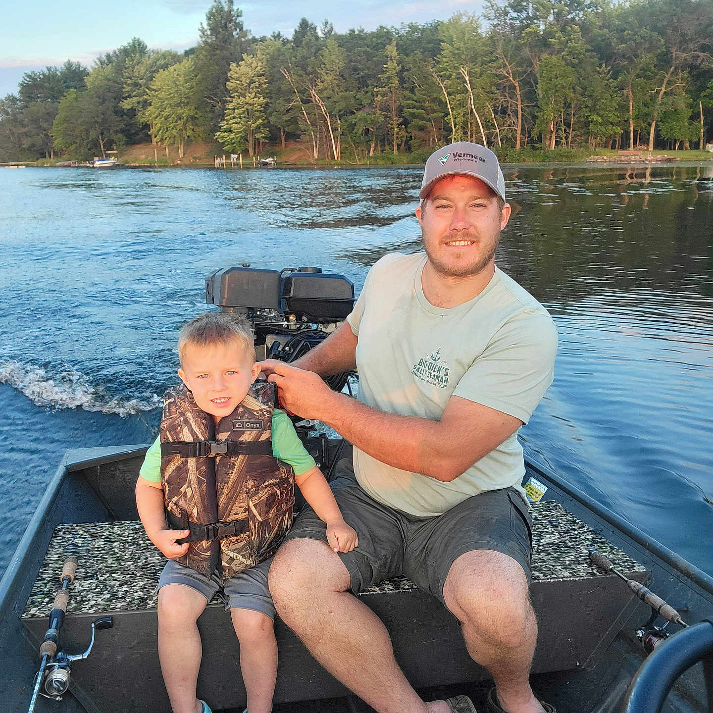 Carter joined the competition — help win amazing prizes! baseballcap, cap, clothing, face, hat, head, lake, lifejacket, nature, outdoors, person, photography, plant, portrait, shorts, summer, tree, vegetation, vest, water