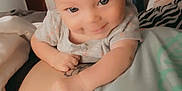 Holloni is registered to the contest to win money with this photo: baby, child, closeup, clothing, cozy, cute, expression, face, hair, hand, happy, holding, indoor, infant, person, playful, portrait, skin, smiling, young