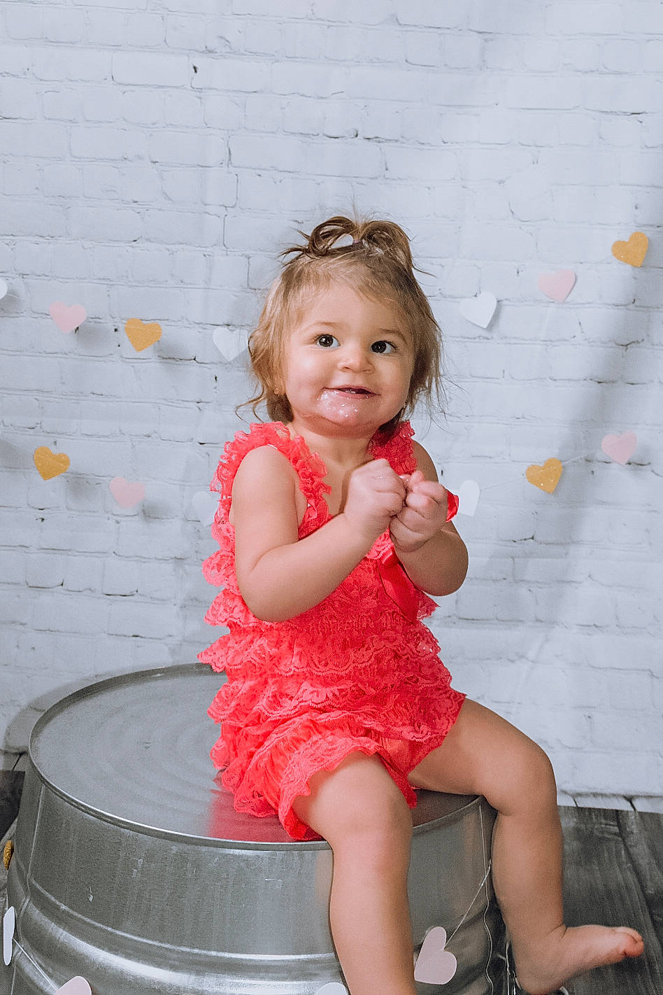Khali is registered to the contest to win money with this photo: baby_toddler_clothing, child, child_model, day_dress, facial_expression, foot, happy, joy, mouth, person, pink, toddler, toe