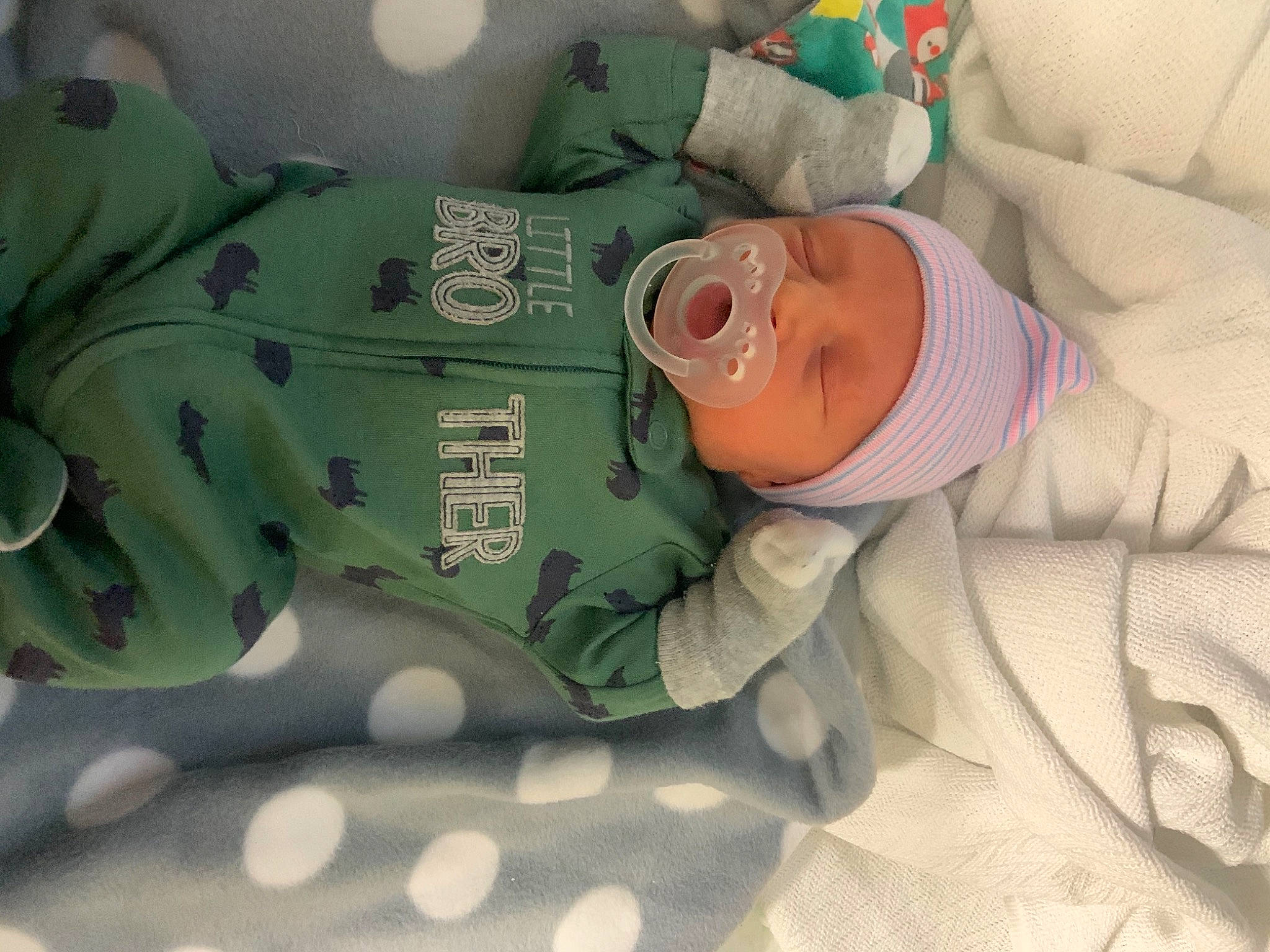 Neil is registered to the contest to win money with this photo: baby, bedtime, birth, child, childbirth, headwear, nap, person, room, sleep