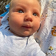 Lino participe au concours pour gagner de l'argent avec cette photo : baby, infant, close_up, face, eyes, hair, onesie, blanket, animal_print, sunlight, outdoor, skin, cheeks, cute, child, portrait, expression, soft_light, young, person