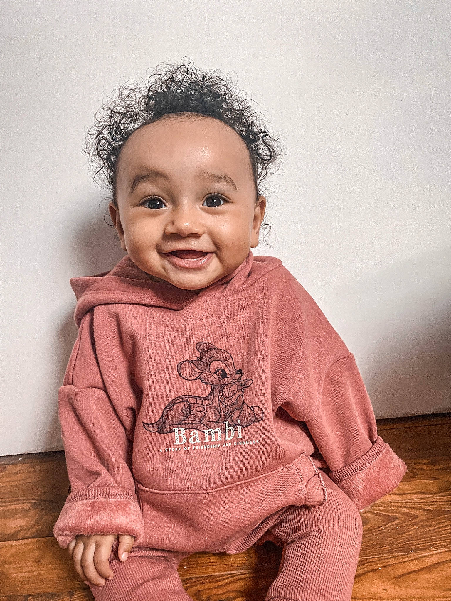 Kamyla participe au concours pour gagner de l'argent avec cette photo : baby, baby_toddler_clothing, cheek, child, flash_photography, flooring, happy, headgear, iris, lip, magenta, nose, organ, outerwear, person, pink, skin, sleeve, smile, toddler