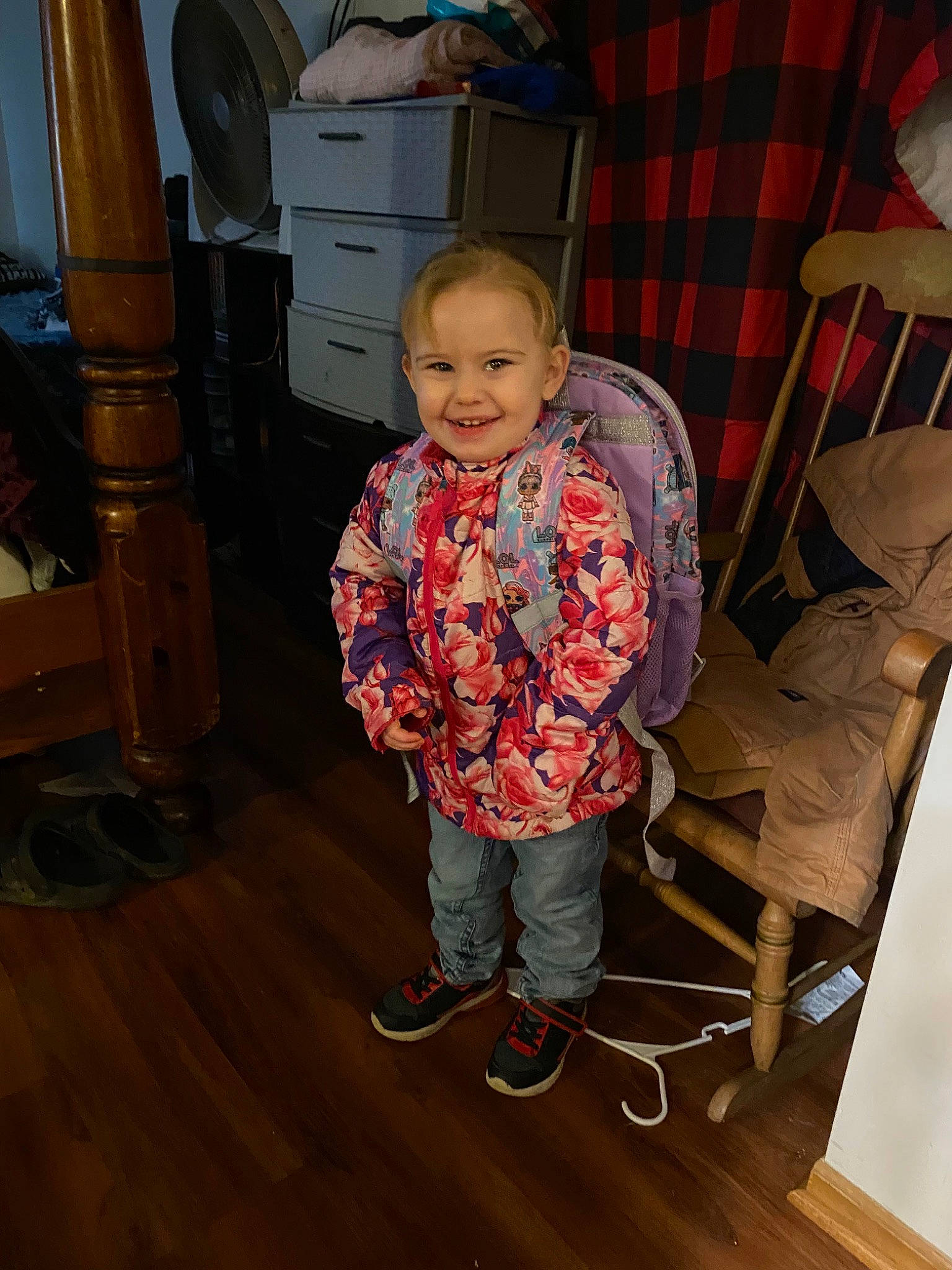 Amy is registered to the contest to win money with this photo: baby_toddler_clothing, cabinetry, chair, comfort, drawer, floor, flooring, fun, hardwood, joy, laminate_flooring, pattern, person, room, smile, sneakers, standing, toddler, varnish, wood