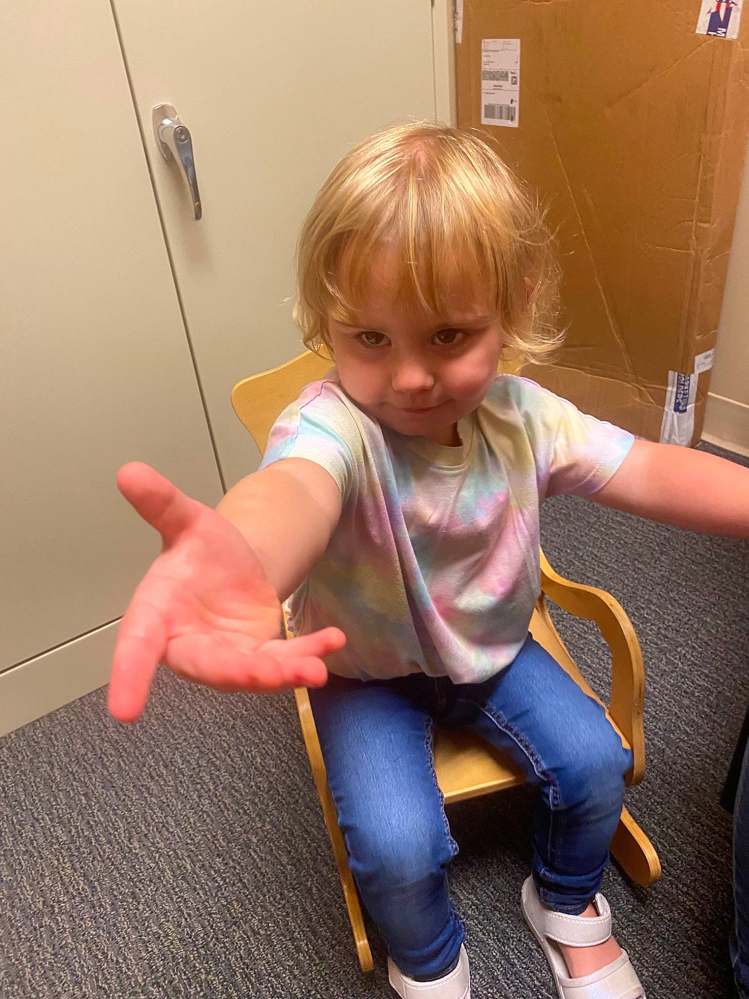 Amy joined the competition — help win amazing prizes! arm, baby_toddler_clothing, blond, cheek, facial_expression, finger, floor, flooring, fun, human_leg, jeans, joint, knee, lap, leg, person, sitting, sock, thigh, thumb