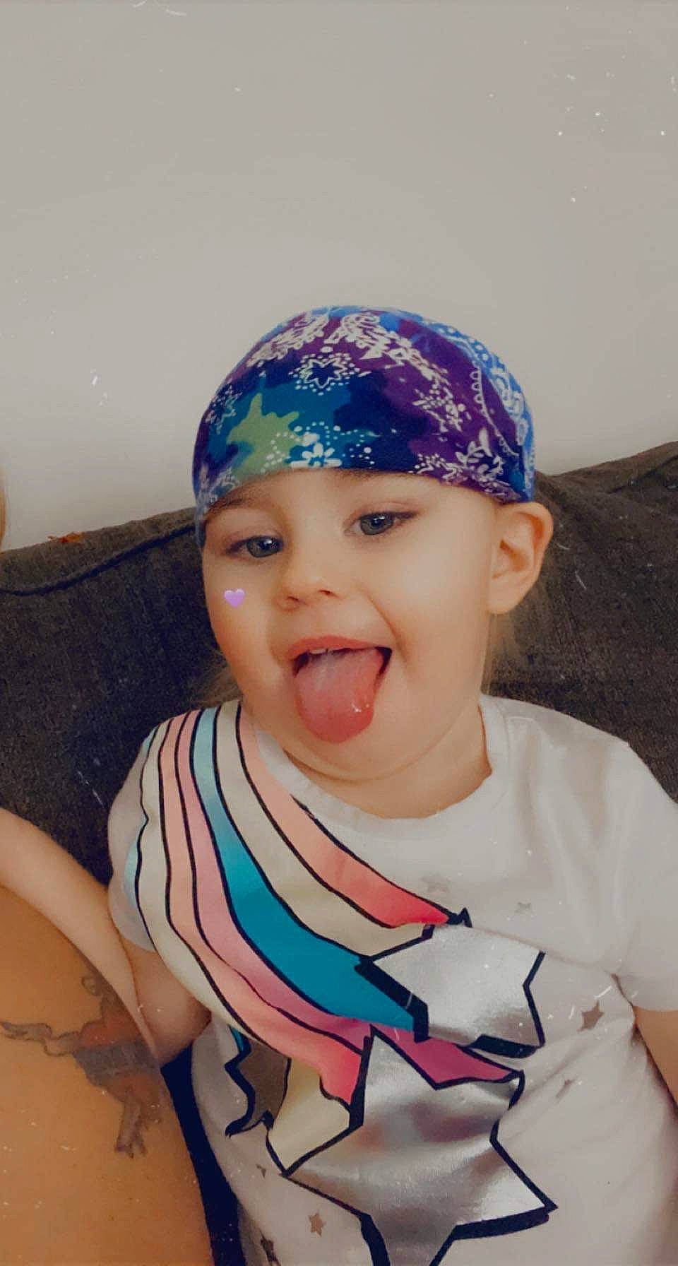 Amy is registered to the contest to win money with this photo: baby, baby_toddler_clothing, baseball_cap, cap, child, cool, electric_blue, eye, eyebrow, fashion_accessory, finger, fun, happy, hat, headpiece, headwear, lip, person, skin, smile