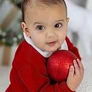 Giuseppe is registered to the contest to win money with this photo: baby, ball, bodypart, clothing, cricket, cricketball, face, finger, football, hand, happy, head, knitwear, person, photography, portrait, smile, soccer, sport, sweater