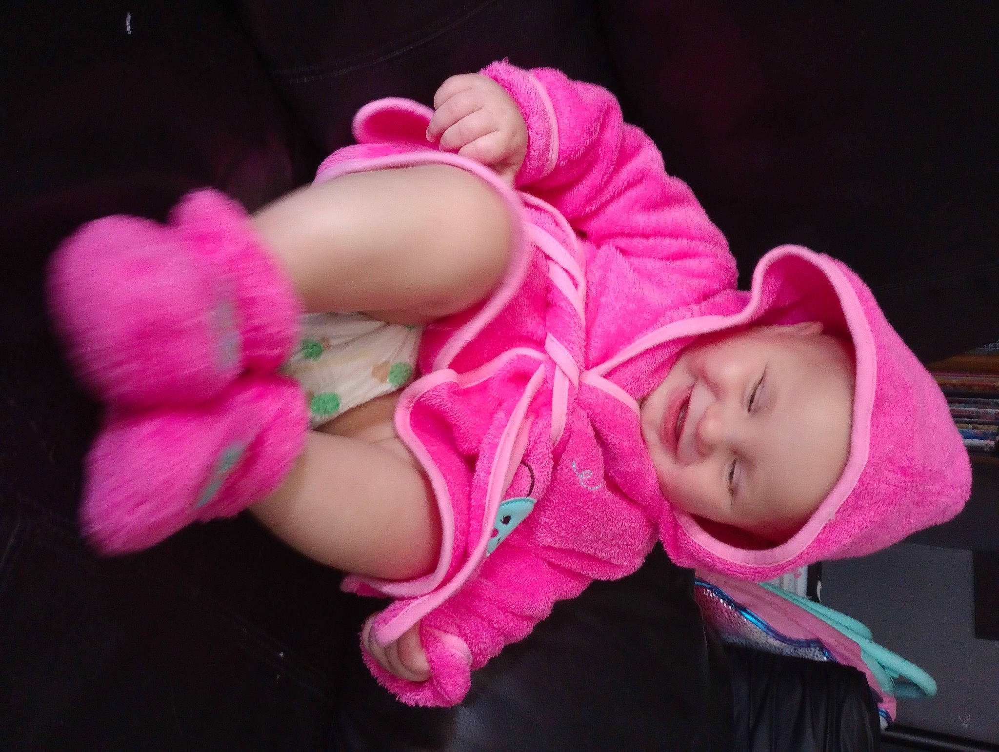 Gabrielle is registered to the contest to win money with this photo: baby, baby_products, baby_toddler_clothing, beanie, cheek, child, comfort, fashion_accessory, foot, hat, headwear, human_leg, lip, magenta, nail, nose, person, pink, sitting, skin